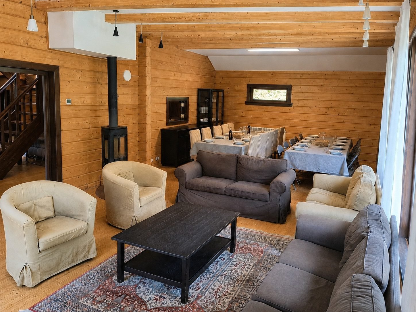 Living room and dining room in one space, with the wood stove